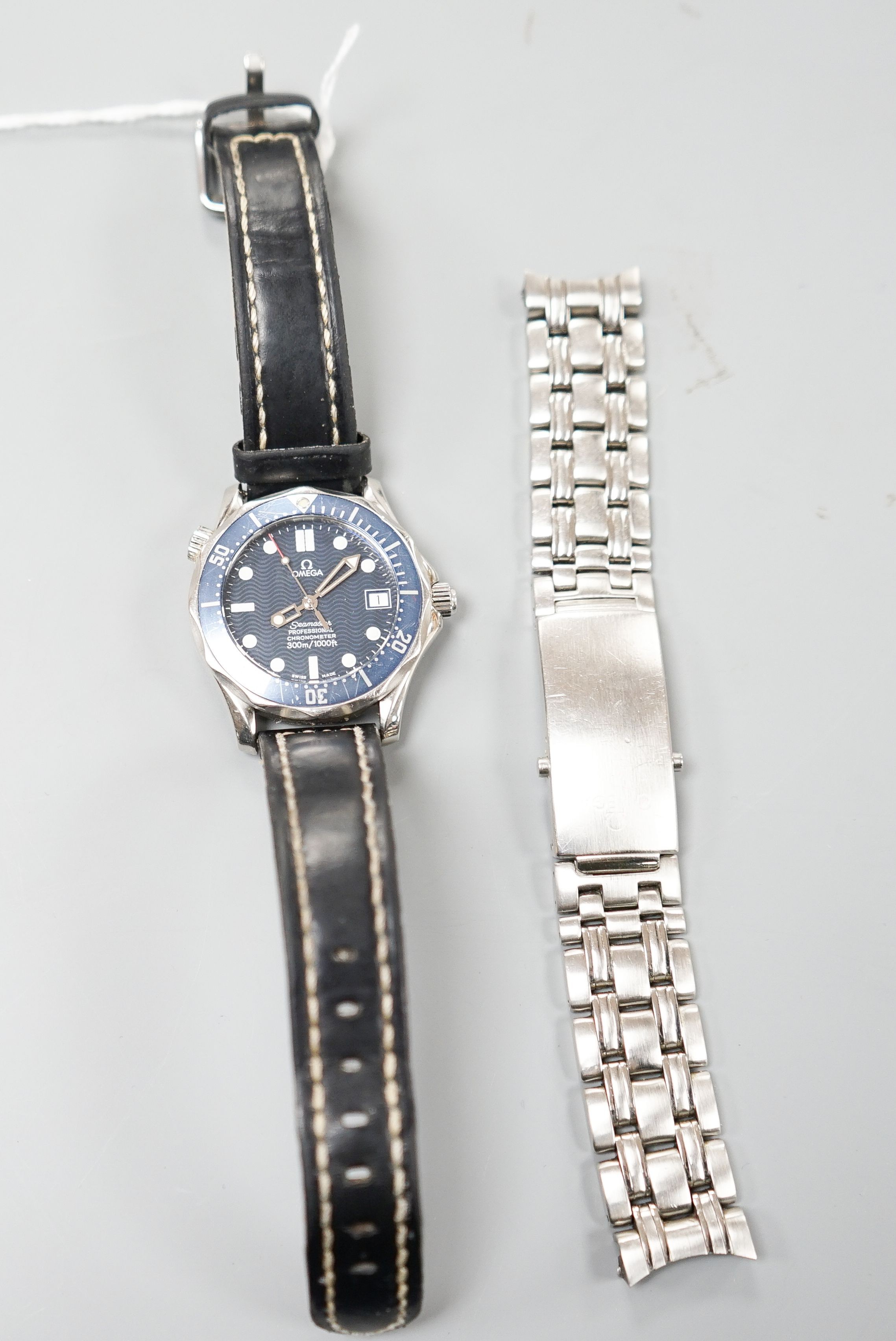 A gentleman's 2006 stainless steel Omega Seamaster Professional chronometer wrist watch, movement c.1120, on associated leather strap, but comes with original Omega steel bracelet, no box or papers